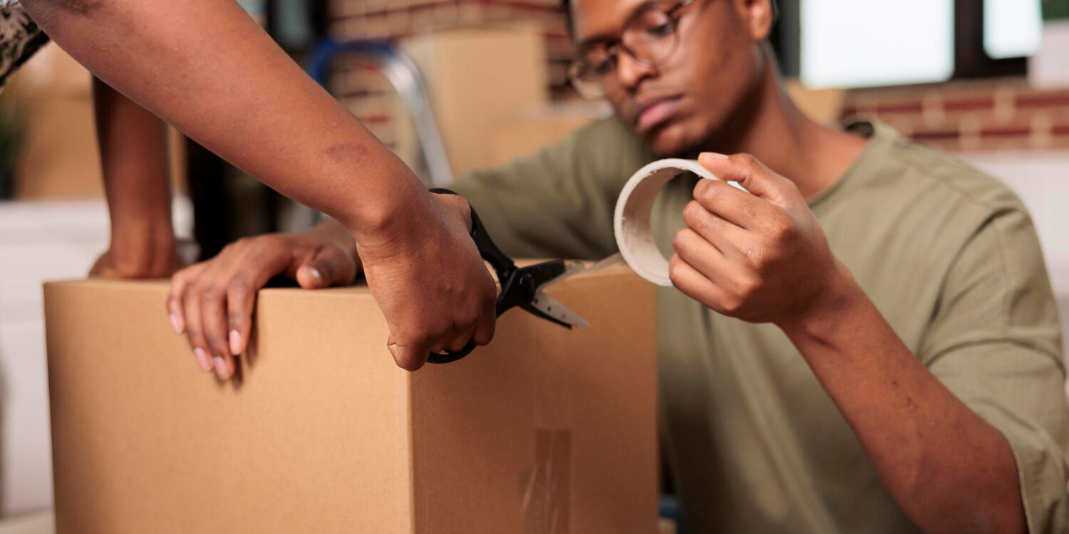 married-partners-sealing-cardboard-boxes-with-adhesive-tape-move-furniture-new-real-estate-property-packing-things-shipping-storage-cargo-enjoying-flat-relocation-close-up