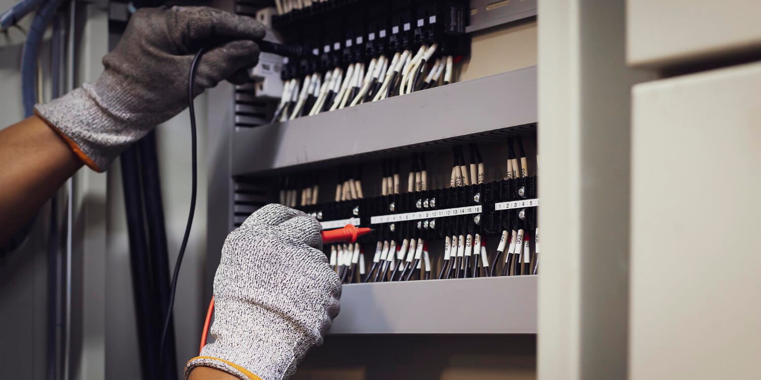 technician-checking-operation-electrical-control-equipment