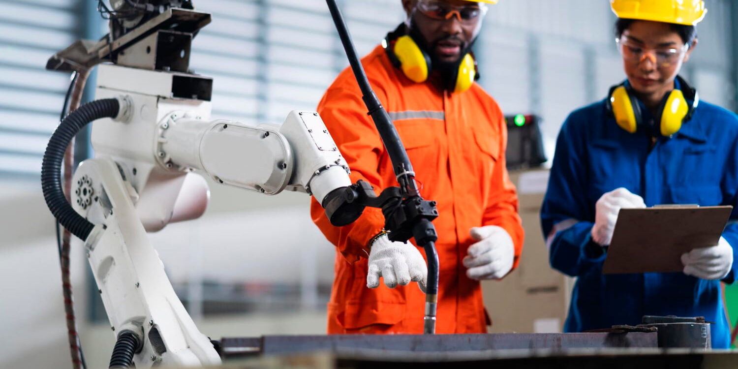 engineer-cooperation-male-female-technician-maintenance-control-relay-robot-arm-system-welding-with-tablet-laptop-control-quality-operate-process-work-heavy-industry-40-manufacturing-factory Facilities Maintenance Supplies