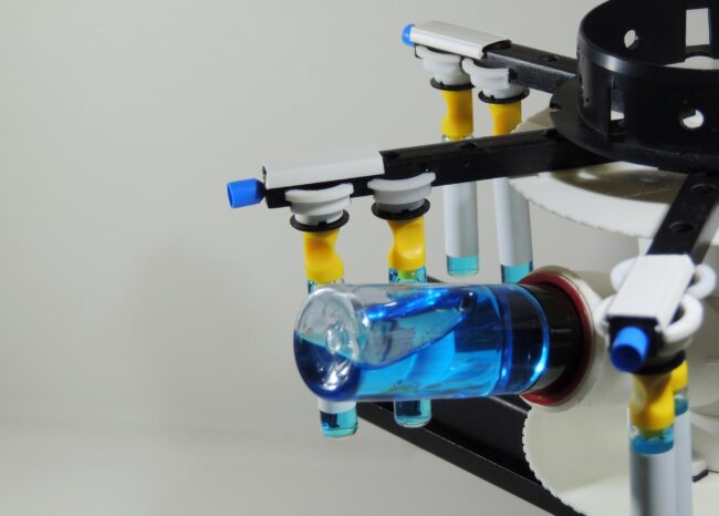 testing-laboratory-equipment-analyze-vials-with-blue-liquid