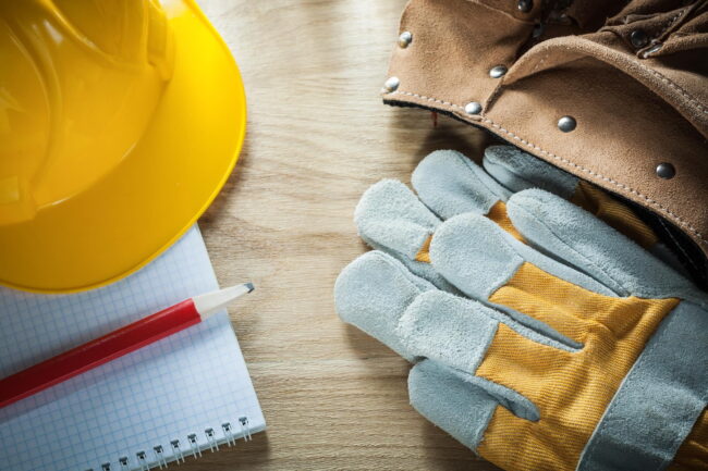 leather-tool-belt-protective-gloves-building-helmet-copybook-pencil
